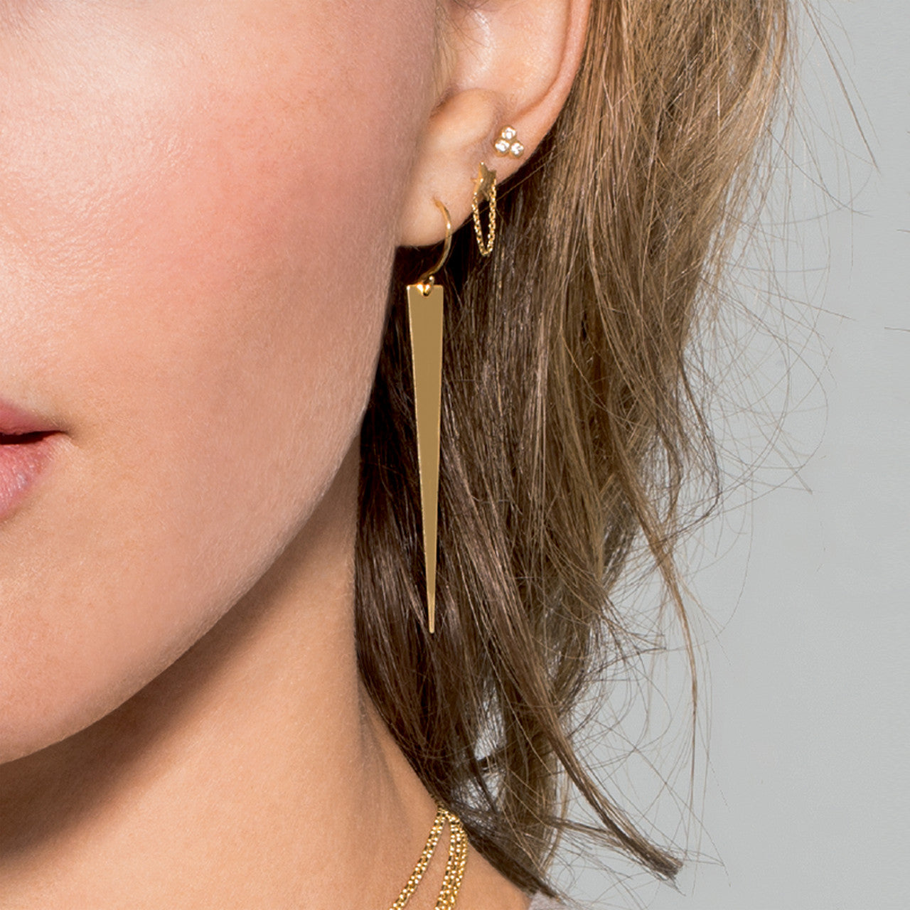 Simple 4 point star earrings with chain drape by My Store, showcasing a delicate design and elegant shine.