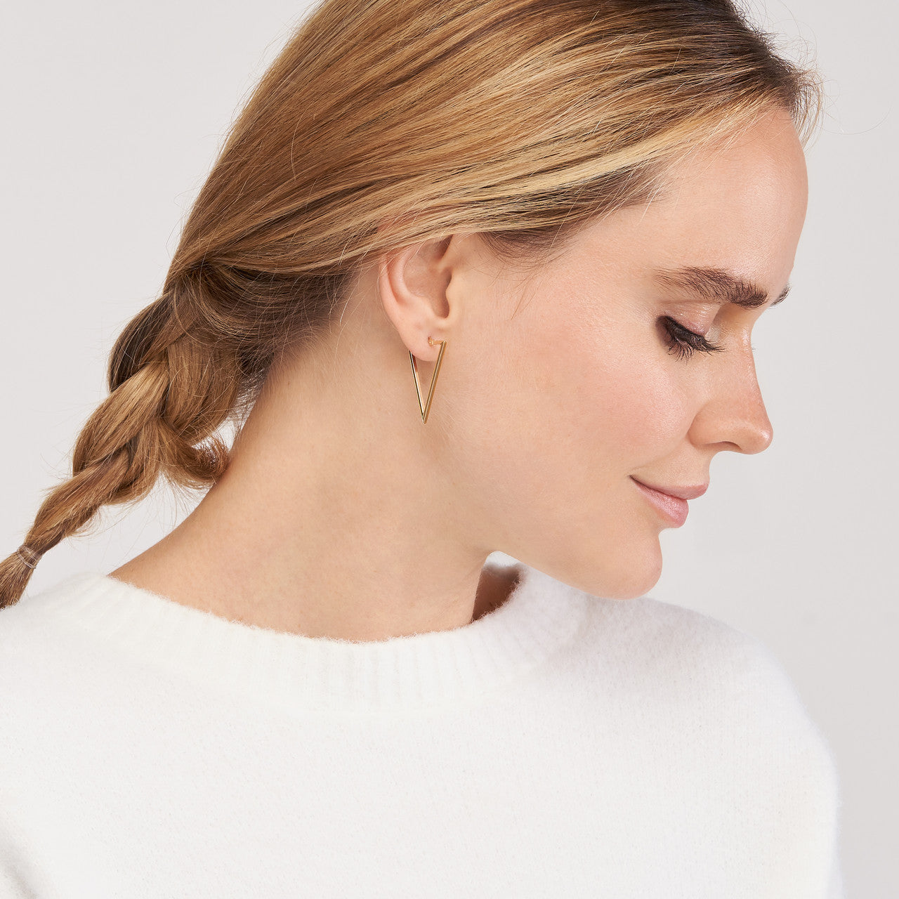 Simple triangle hoop earrings by My Store, featuring a sleek design and polished finish.