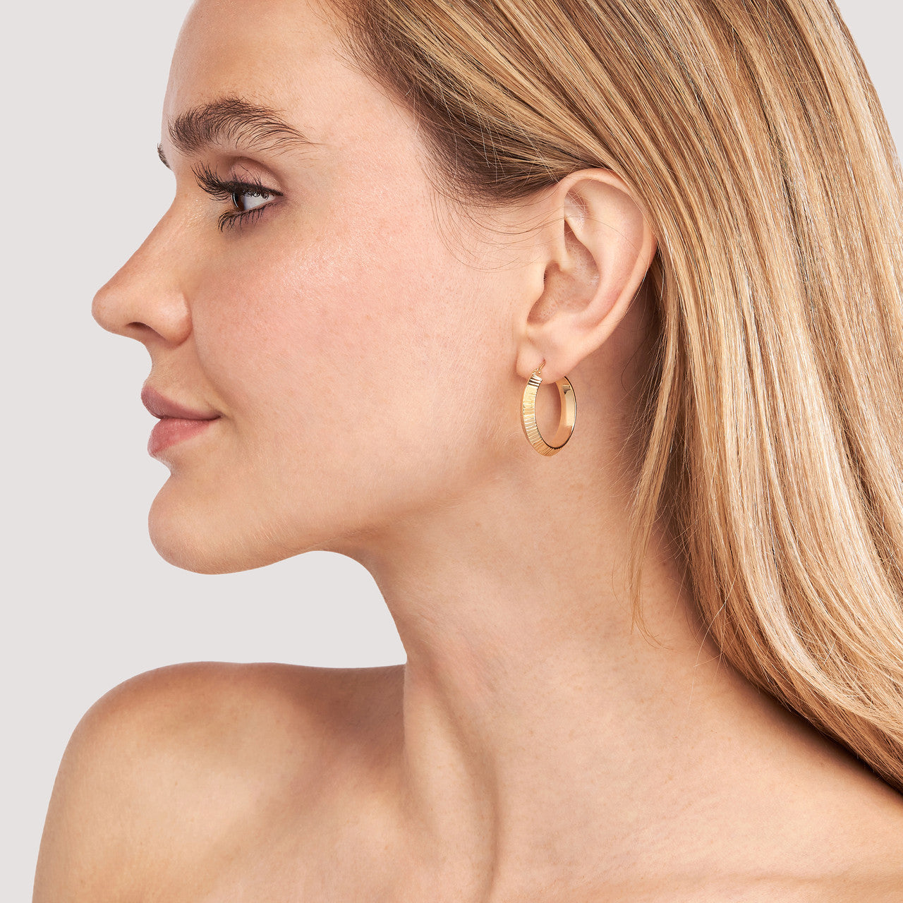 Simple 20x4mm D/C knife edge round hoops in silver, showcasing a sleek and modern design.
