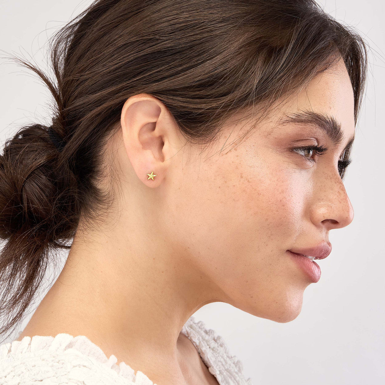 Simple starfish stud earrings by My Store with a polished silver finish and intricate detailing.